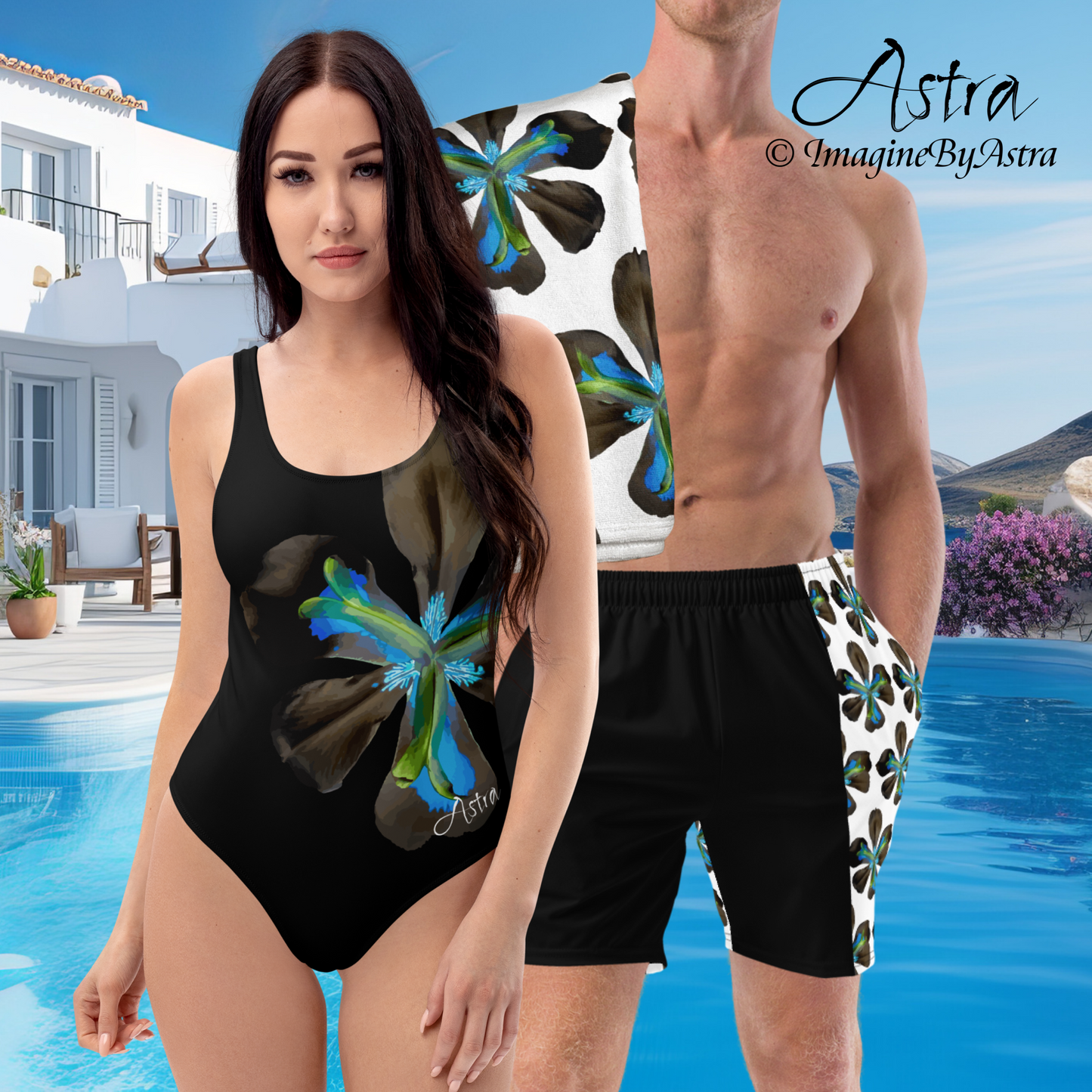 From the Astra Swimwear lineup: a man and woman pose in matching couple swimsuits. The woman wears a black one-piece swimsuit with a large vibrant blue tropical flower graphic down one side. The man wears black swim trunks with a white panel on one side bearing the same tropical blue flower in a repeating pattern. He has a white towel with the matching floral print slung over his shoulder. Part of the Tropical Iris Collection by designer, Imagine By Astra.