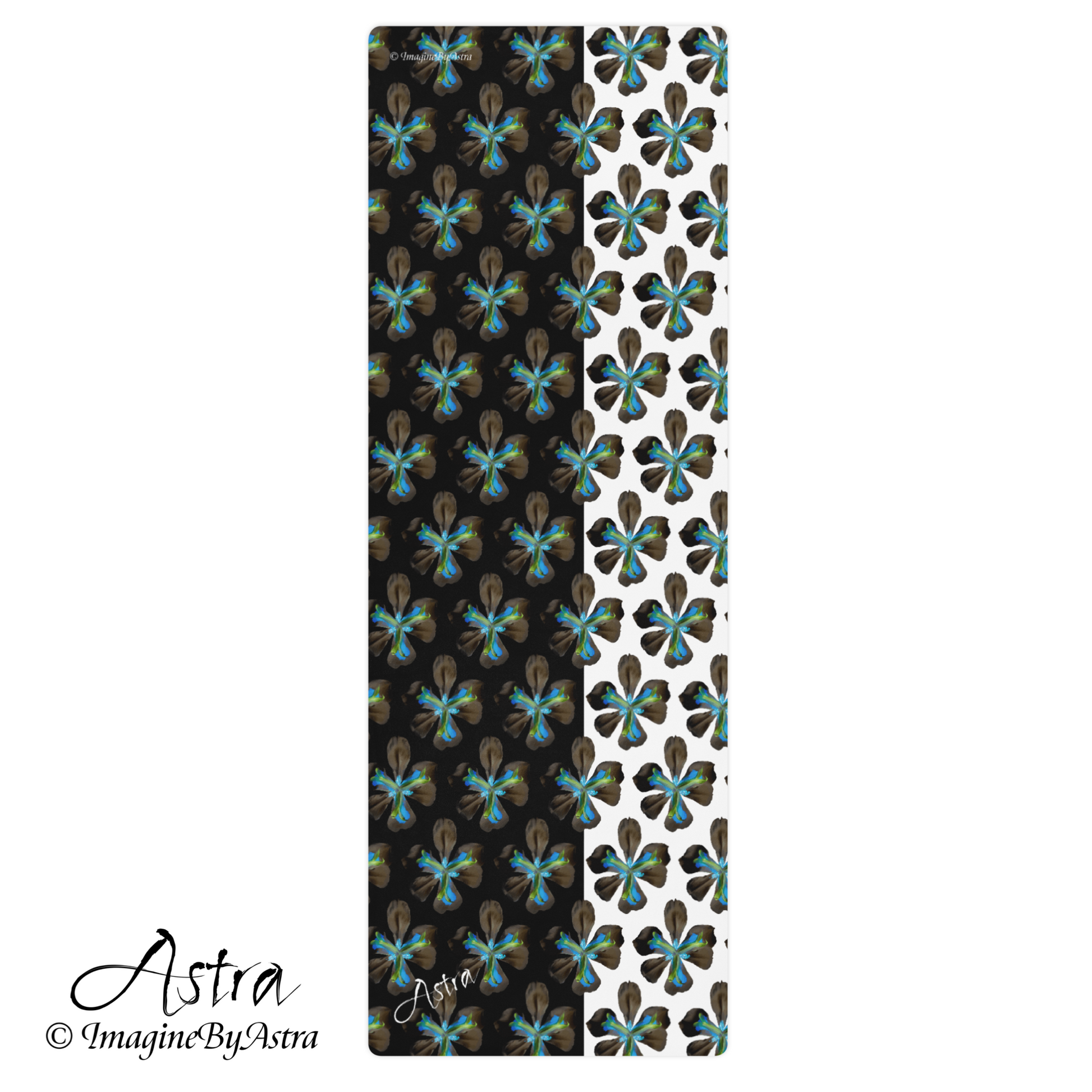 A yoga mat with a striking two toned black and white surface with a bright blue tropical flower print on top. From brand, Imagine by Astra Activewear.