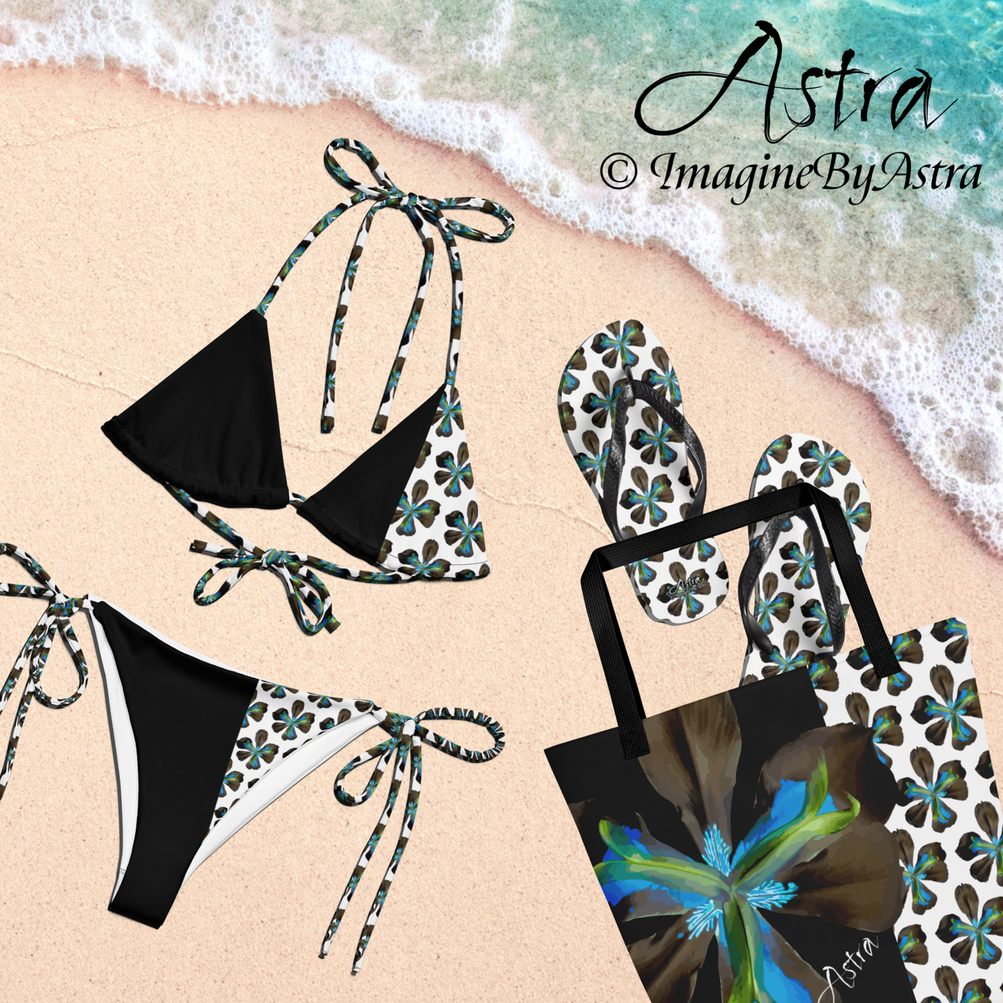 From the Astra Swimwear lineup: a black string bikini with a white panel running along one side with a vibrant blue tropical flower print is laying on a tropical beach next to the matching tote bag. Flip flops with the same vibrant flower print spill out of the bag. Part of the Tropical Iris Collection by designer, Imagine By Astra.