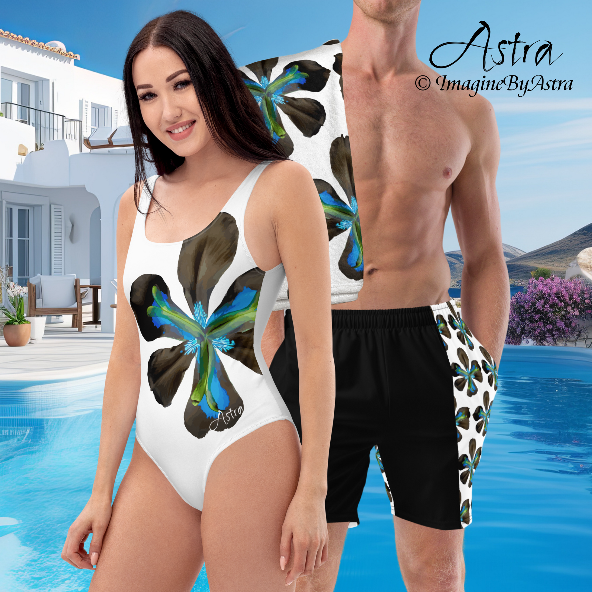 Matching couples swimsuits with blue tropical flower print. A woman wears a women’s white one-piece swimsuit next to a man wearing matching men’s swim trunks, with a resort pool in the background. Part of the Tropical Iris swimwear collection from Imagine by Astra